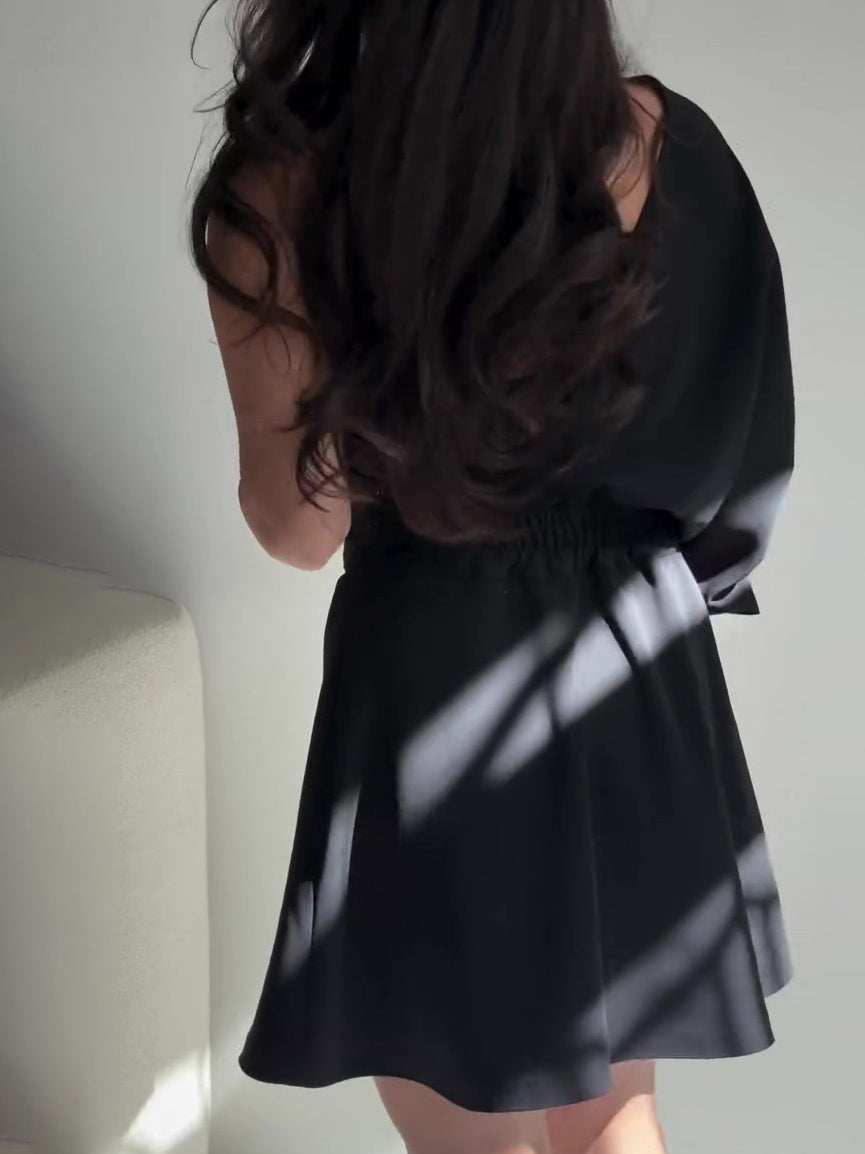 Black Two-Piece Set With Textured Strapless Top And Flared Mini Skirt